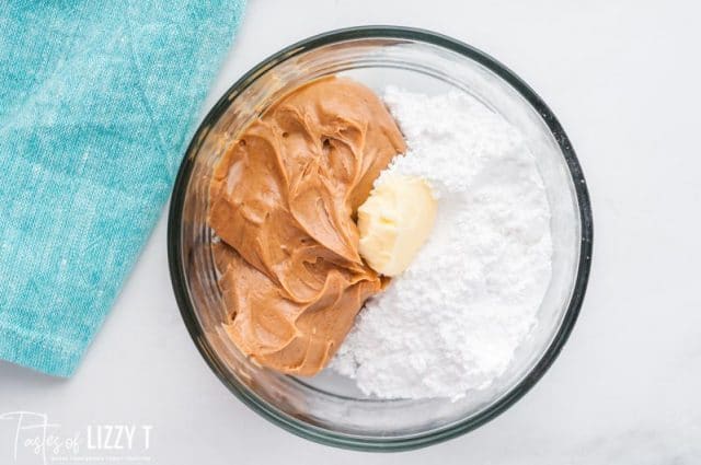 peanut butter, butter and sugar in a bowl