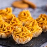 no bake pumpkin cheesecake mini pies on a slate board