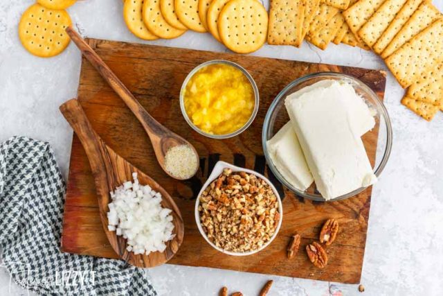 ingredients for cheese ball on wooden platter