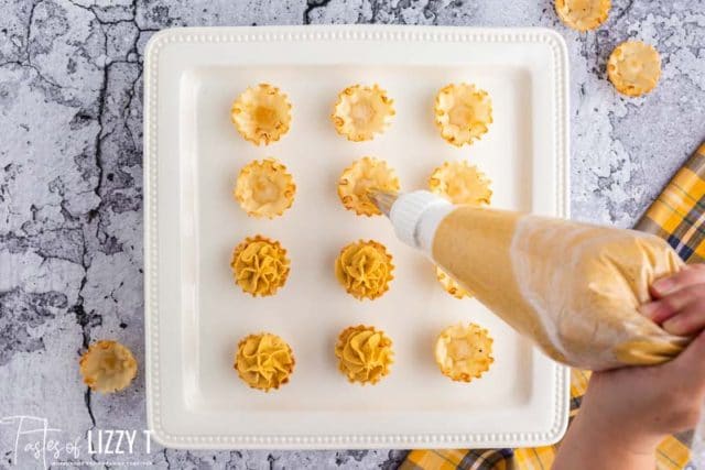 filling pumpkin mini pie shells