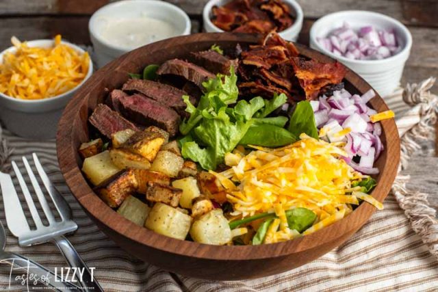 wooden bowl of steak and potato salad