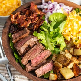 salad with steak, potatoes and bacon