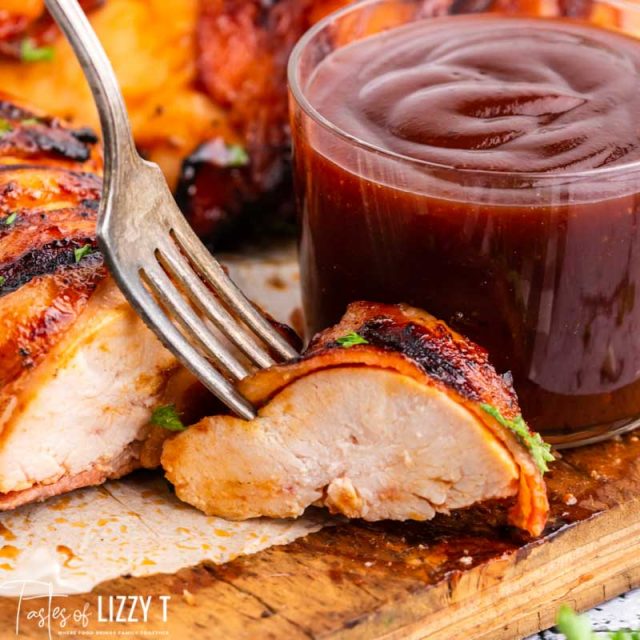 slice of bacon wrapped bbq chicken with a fork