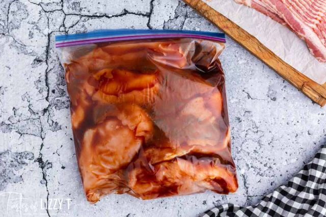 chicken marinating in bbq sauce in a plastic bag
