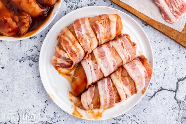 uncooked bacon wrapped chicken