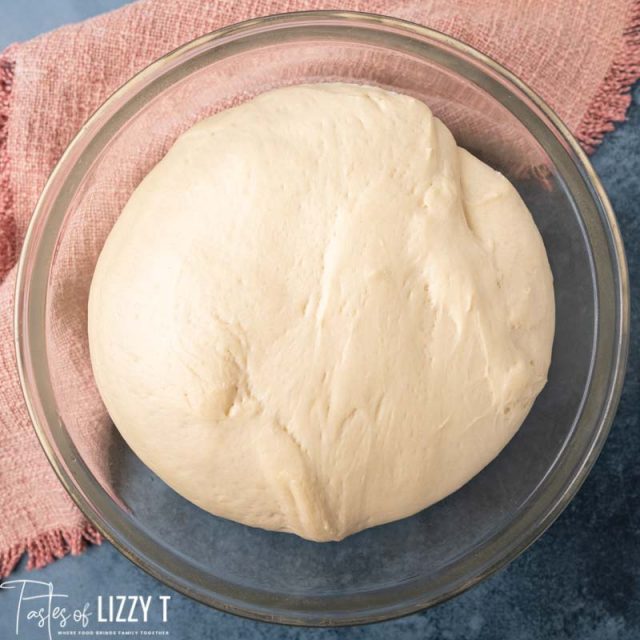 risen bread dough in a bowl