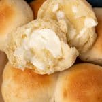 brown and serve dinner rolls, one with butter