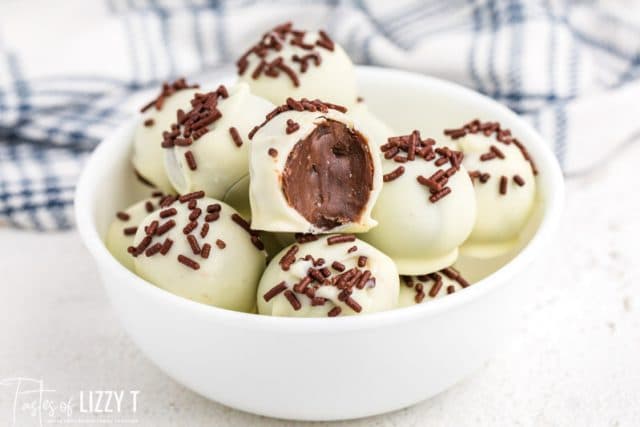 bowl of brownie truffles with one bite out