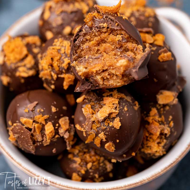close up of pile of butterfinger truffles, one with a bite out
