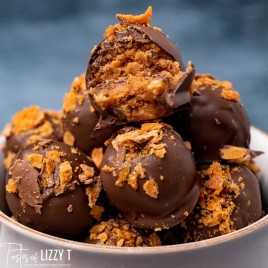 pile of butterfinger truffles, one with a bite out