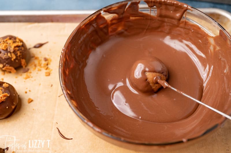truffle dipping in melted chocolate