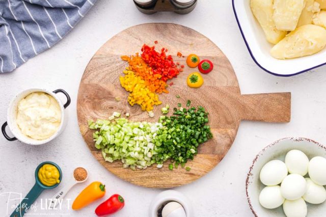 chopped veggies on a wooden board