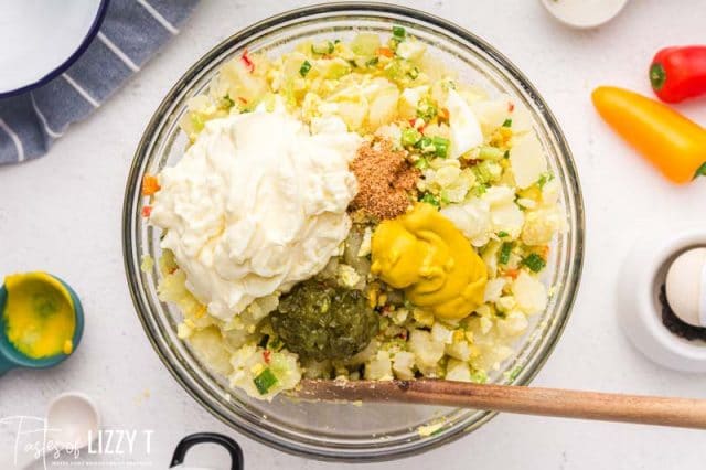 ingredients for cajun potato salad in a mixing bowl