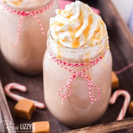 glass of hot chocolate with whipped cream and caramel