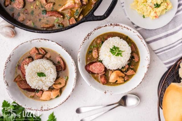 two bowls of chicken sausage gumbo with rice