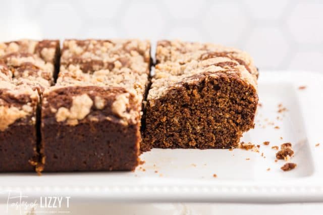 sliced glorified gingerbread cake with one piece missing