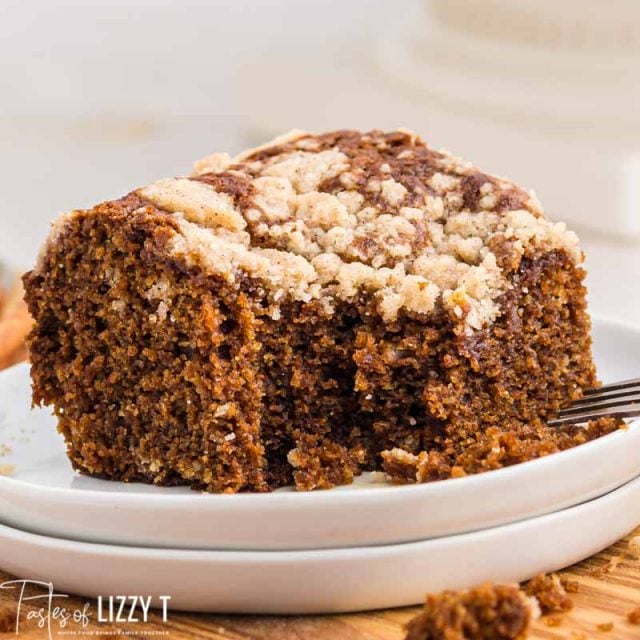 piece of gingerbread cake on a plate with a bite out