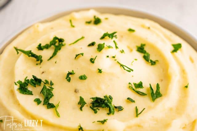 bowl of creamy mashed potatoes with parsley