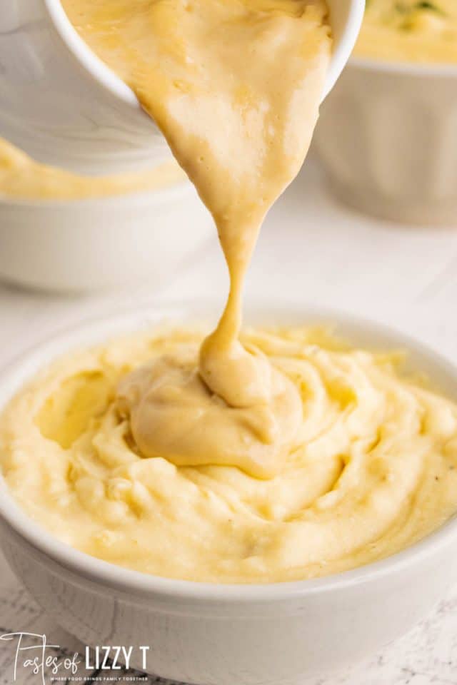 gravy pouring over mashed potatoes