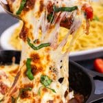 italian chicken on a spoon with stringy cheese