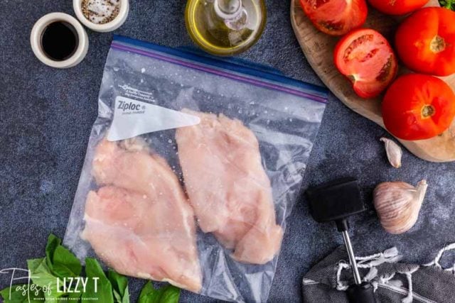 two chicken breasts in a plastic bag