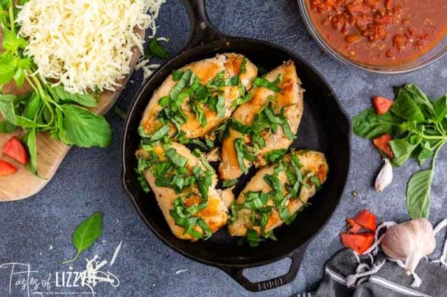 chicken and fresh basil in a skillet