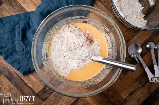 flour mixture over wet ingredients in a mixing bowl