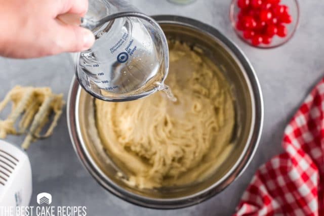 pouring 7up in cake batter bowl