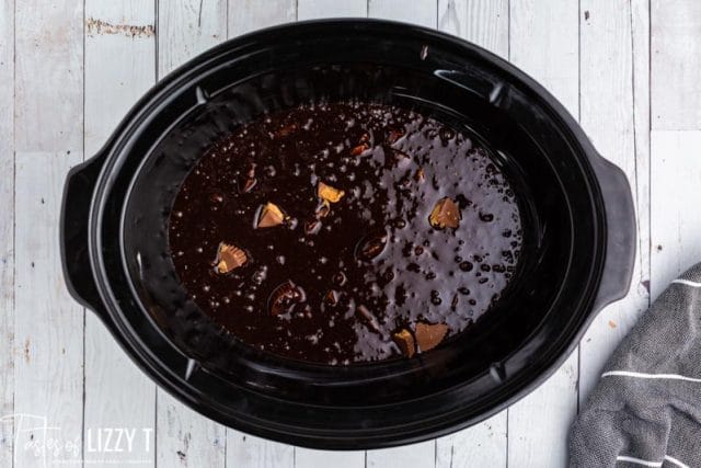 uncooked brownie batter in a slow cooker