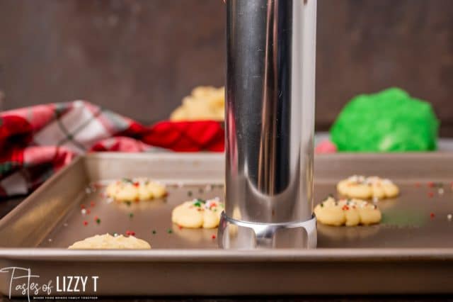 cookie press on a cookie sheet