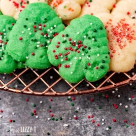 christmas tree cookies with sprinkles on a wire rack