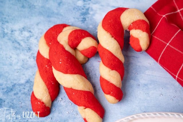 3 candy cane cookies on a table
