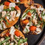 overhead view of baked chicken caprese pizzas