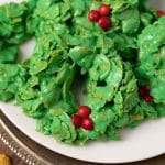 green cornflake cookies on a plate