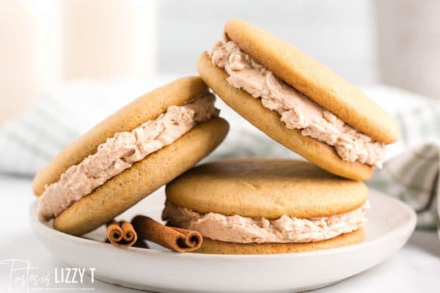 stack of three cinnamon cookie sandwiches on a plate