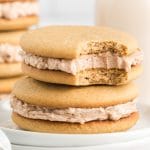stack of two cinnamon buttercream cookie sandwiches on a plate