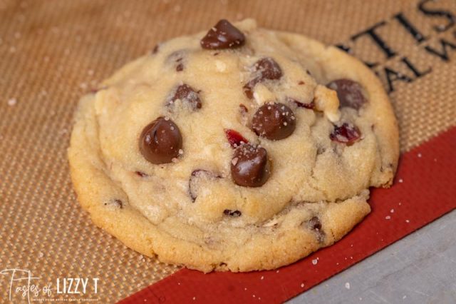 a cranberry chocolate chip cookie on a baking sheet