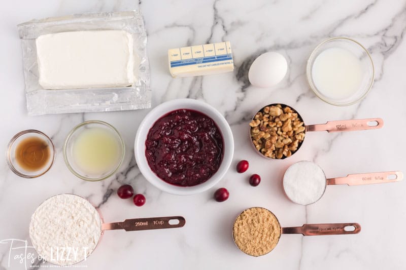 ingredients for cranberry cheesecake bars on a table