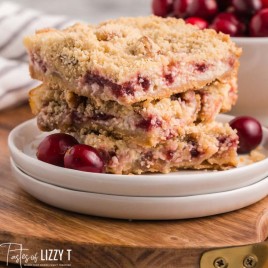 stack of 3 cranberry cream cheese bars on a plate