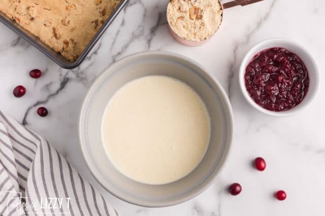 cheesecake batter for cranberry bars in a bowl