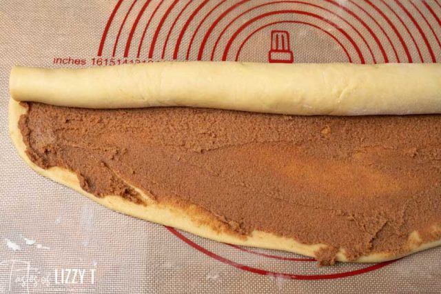 long roll of cinnamon roll dough