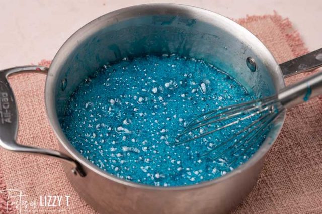 blue sugar boiling in a pan