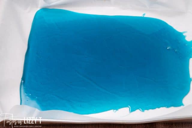 blue hard candy cooled on parchment paper