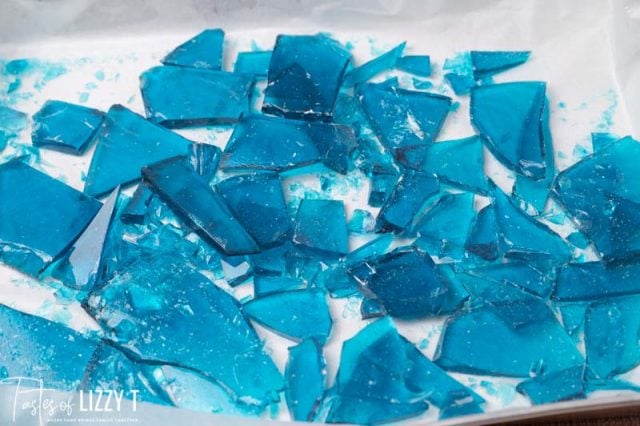 blue candy cracked in pieces on a baking sheet