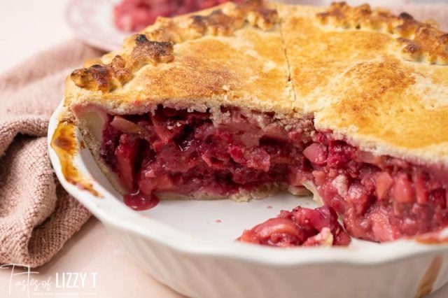 half of a cranberry pie in a pie plate