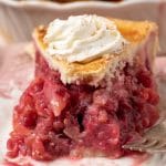 piece of cranberry pear pie with one bite missing