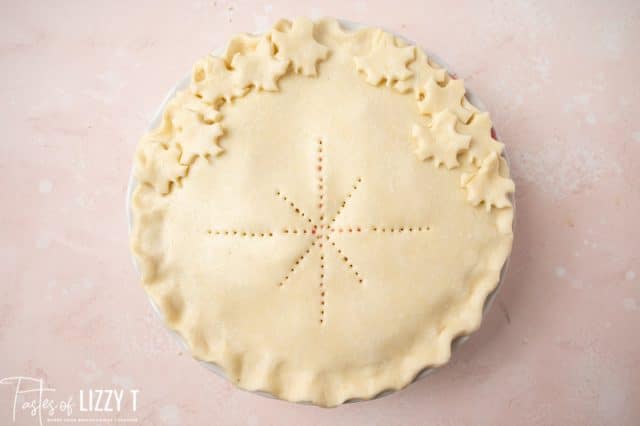 unbaked pie with leaves and star shapes