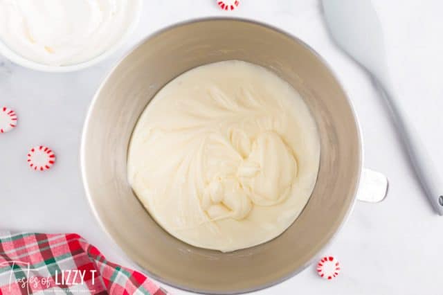 cream cheese and powdered sugar in a mixing bowl