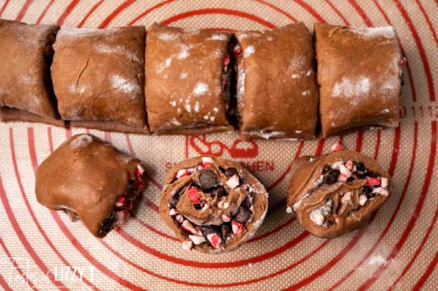 chocolate mocha sweet rolls sliced on a baking mat