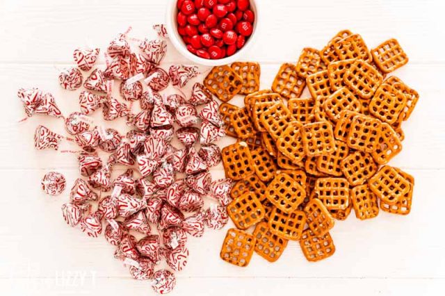 pretzels, hershey kisses and m&ms on a table